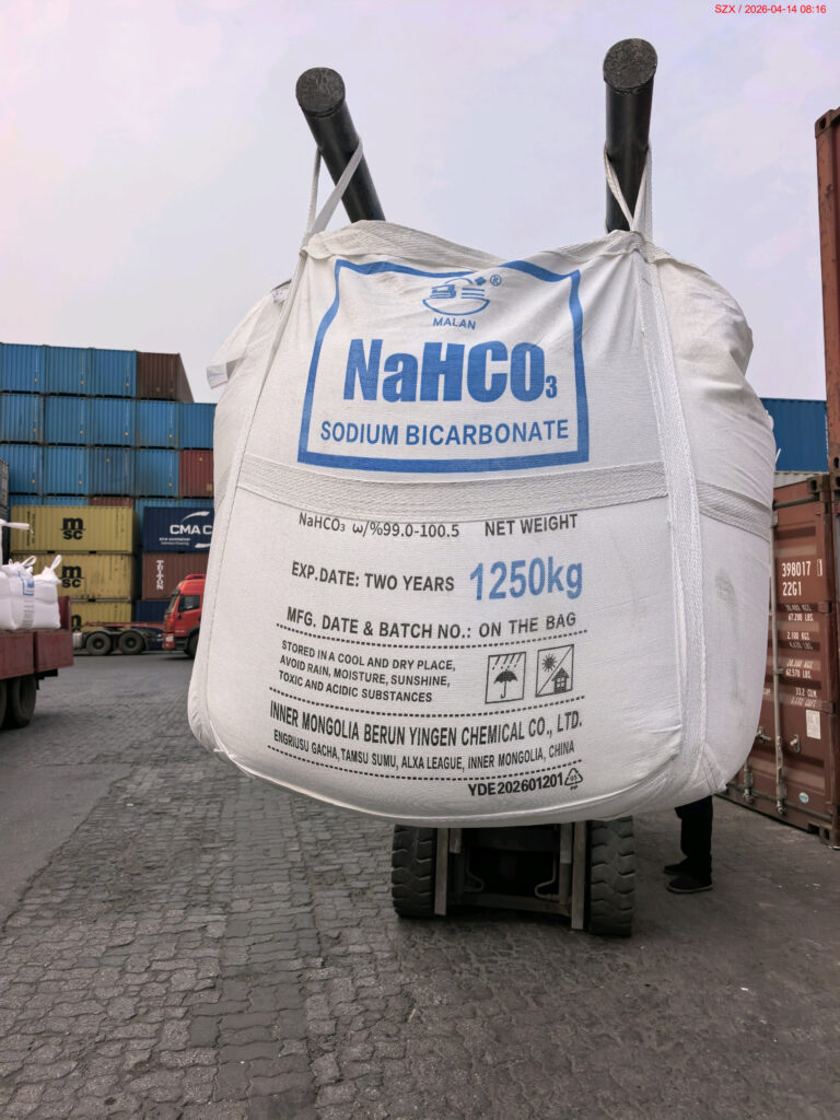A 1,250 kg sodium bicarbonate FIBC being handled by forklift in a Shanghai container yard